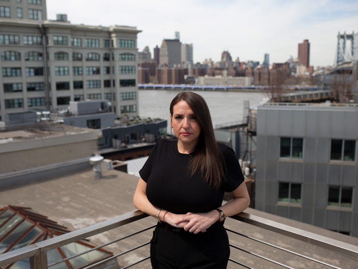 Dana Rachlin poses for a portrait on the roof of her DUMBO office building.