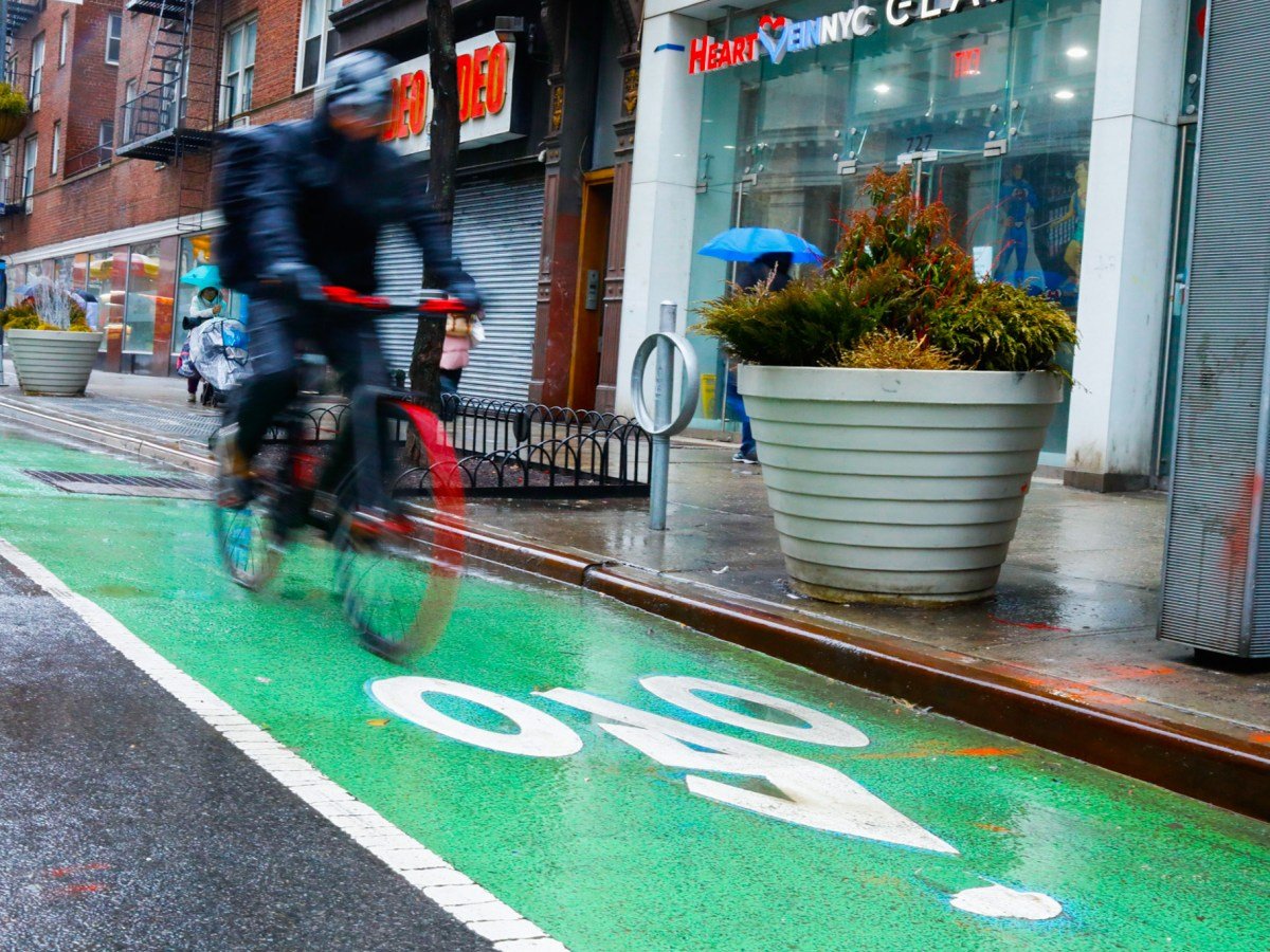 Cyclists ride in a Chelsea, Manhattan bike lane,