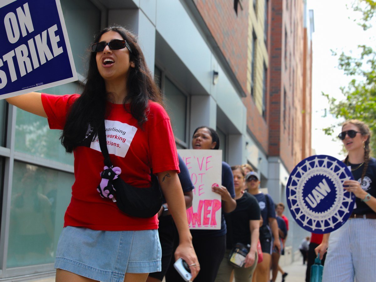 Bronx Defenders organized with the UAW walk the picket line outside the legal group’s offices on East 161st Street,