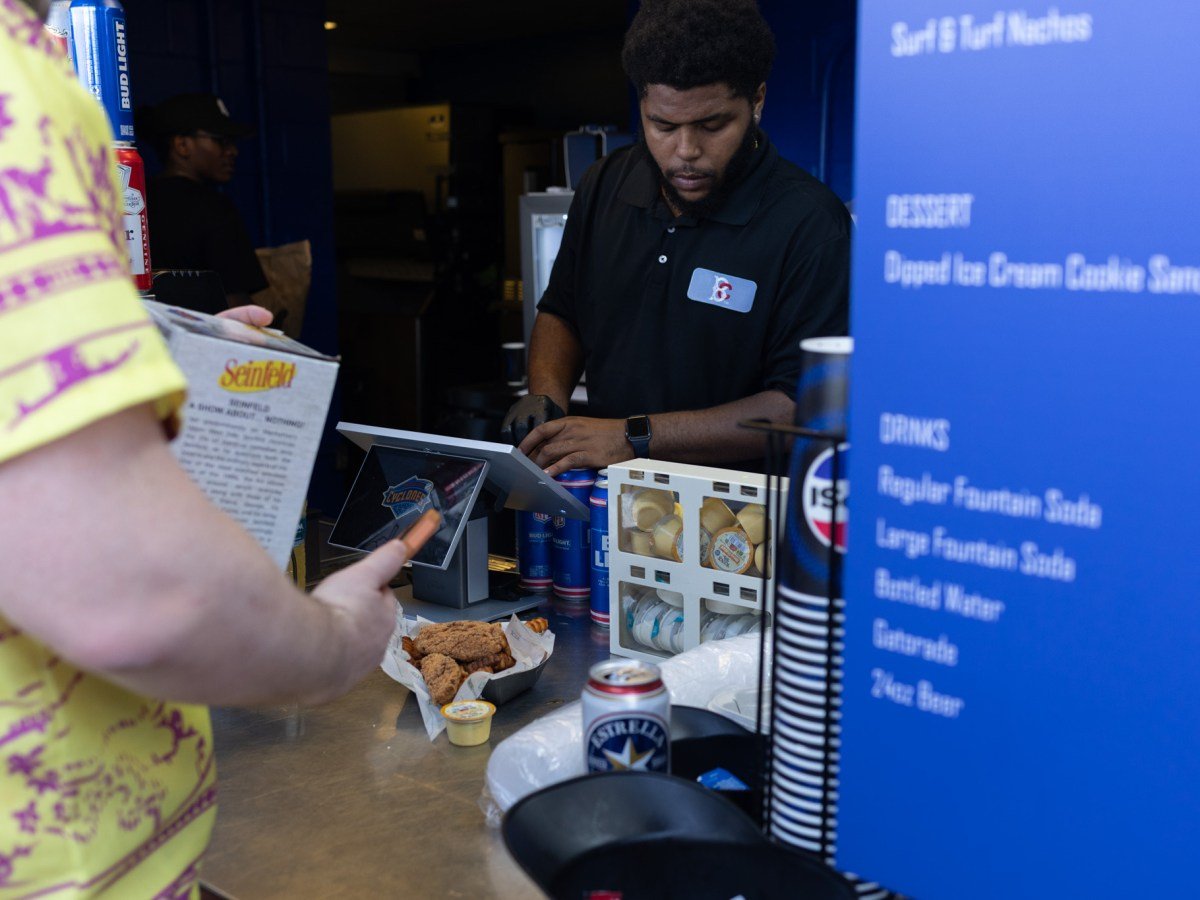 Concession workers sell food to people attending the Brooklyn Cyclones Seinfeld Day at the Coney Island ballpark